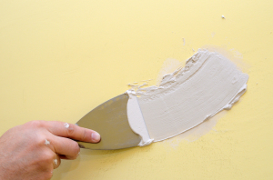 Home Repair - Repairing wall with a coat of spackle in Villanova